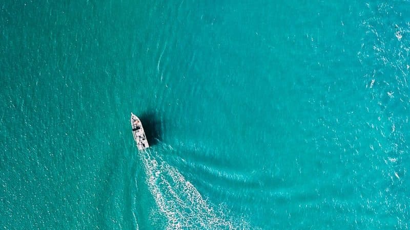 Drone view of yacht sailing in sea water