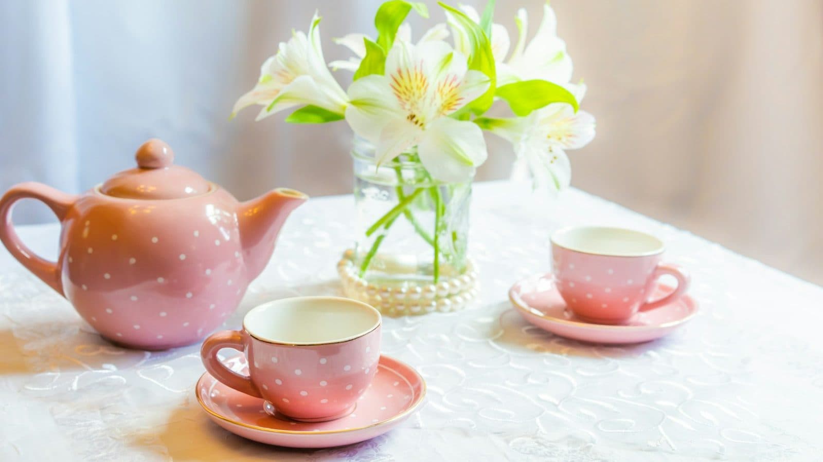 white and yellow flower in clear glass vase